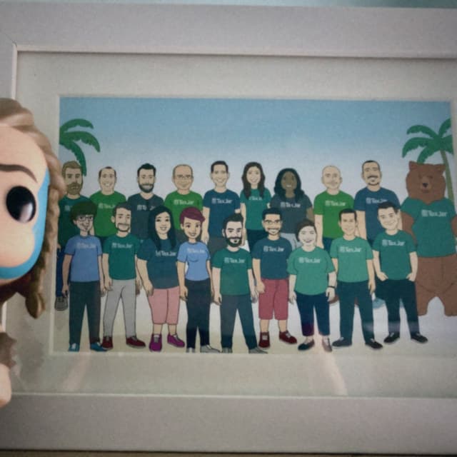 Braveheart figurine in front of a TaxJar team illustration