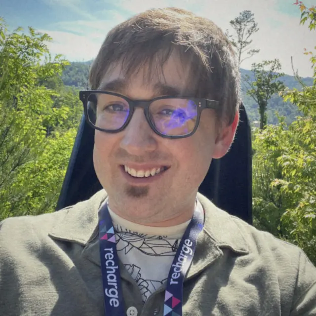 Justin wearing a Recharge lanyard outdoors